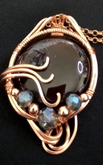 round obsidian pendant with czech crystals